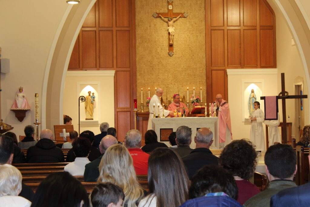 Deacon Christopher Evans, Bishop Bonnar and Father David Misbrener during the Eucharistic prayers