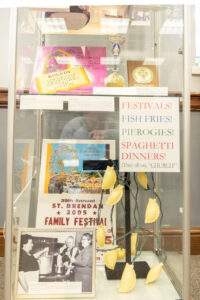 Parish festival display at 80th anniversary exhibit