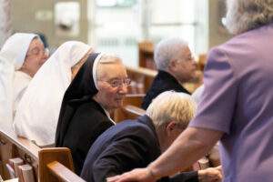Closeup of nuns in front of church