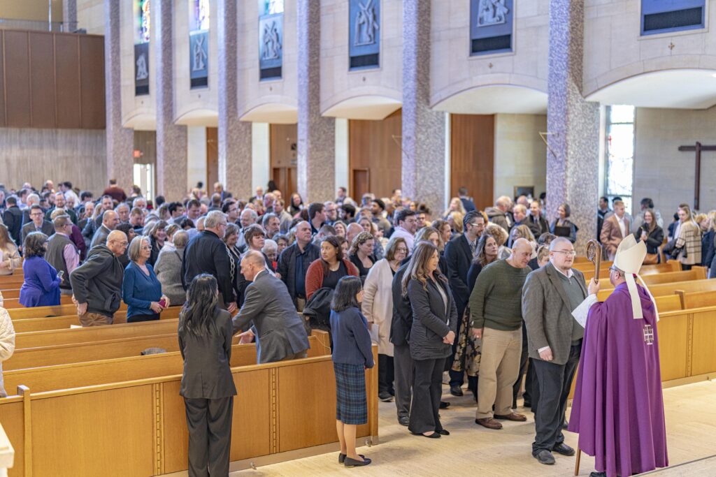 Future confirmands line up to greet Bishop Bonnar at the Rite of Election. Photo by Brian Keith.