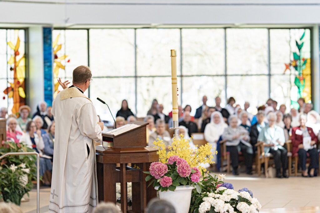 Father Balash reads the Gospel. Photo by Brian Keith.