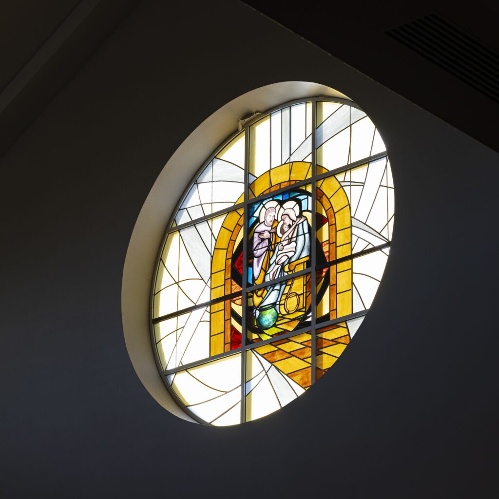 Stained glass window of the Holy Family at Holy Family Parish in Poland. Photo by Brian Keith