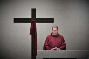 Good Friday at St. William Parish in Champion, 2023. Father Balash stands at the altar. Photo by Robert Zajack.