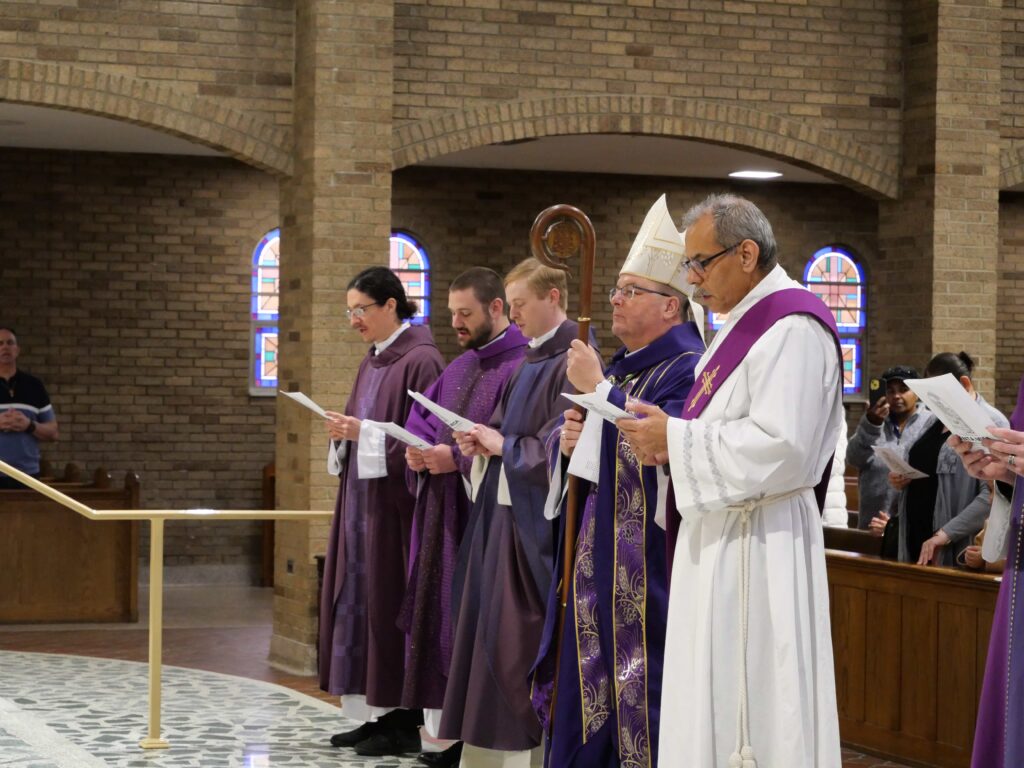 Clergy face the altar at the Second Annual Hispanic Ministry Summit