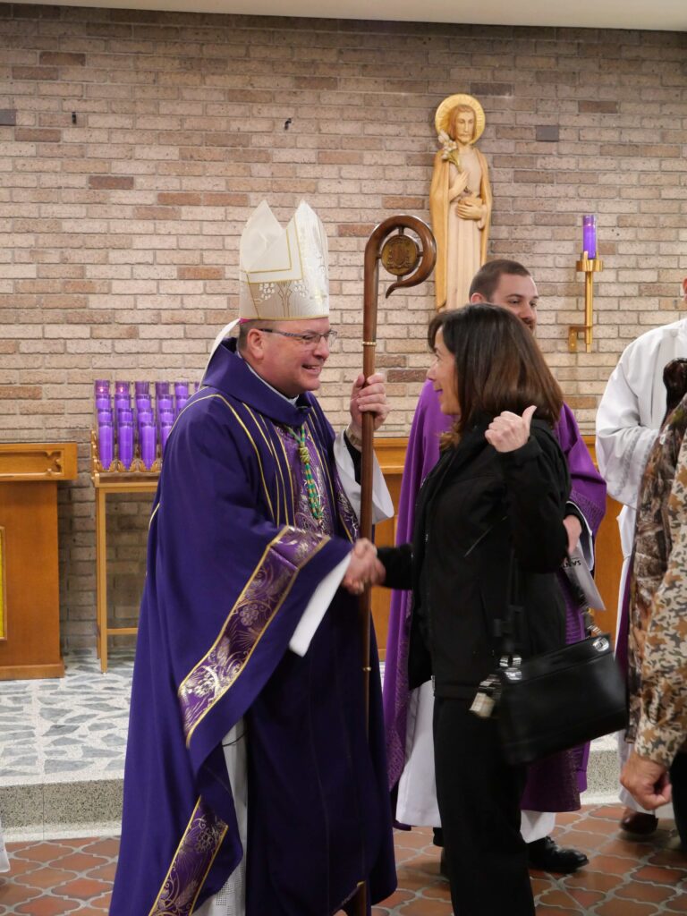 Bishop Bonnar greets guests after the second annual Hispanic Ministry Summit