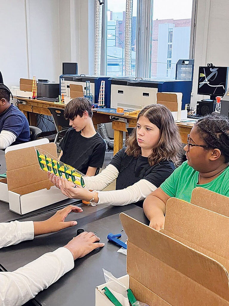 Students prepare to 3D print at St. Nicholas School