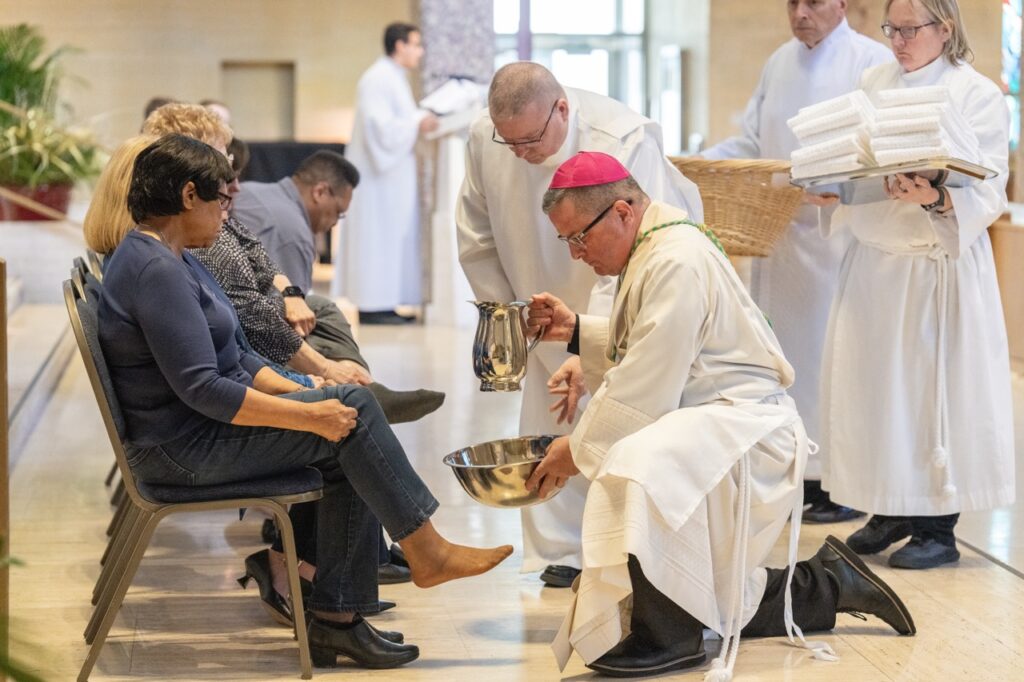 Bishop Bonnar washes feet during Holy Thursday at St. Columba Cathedral