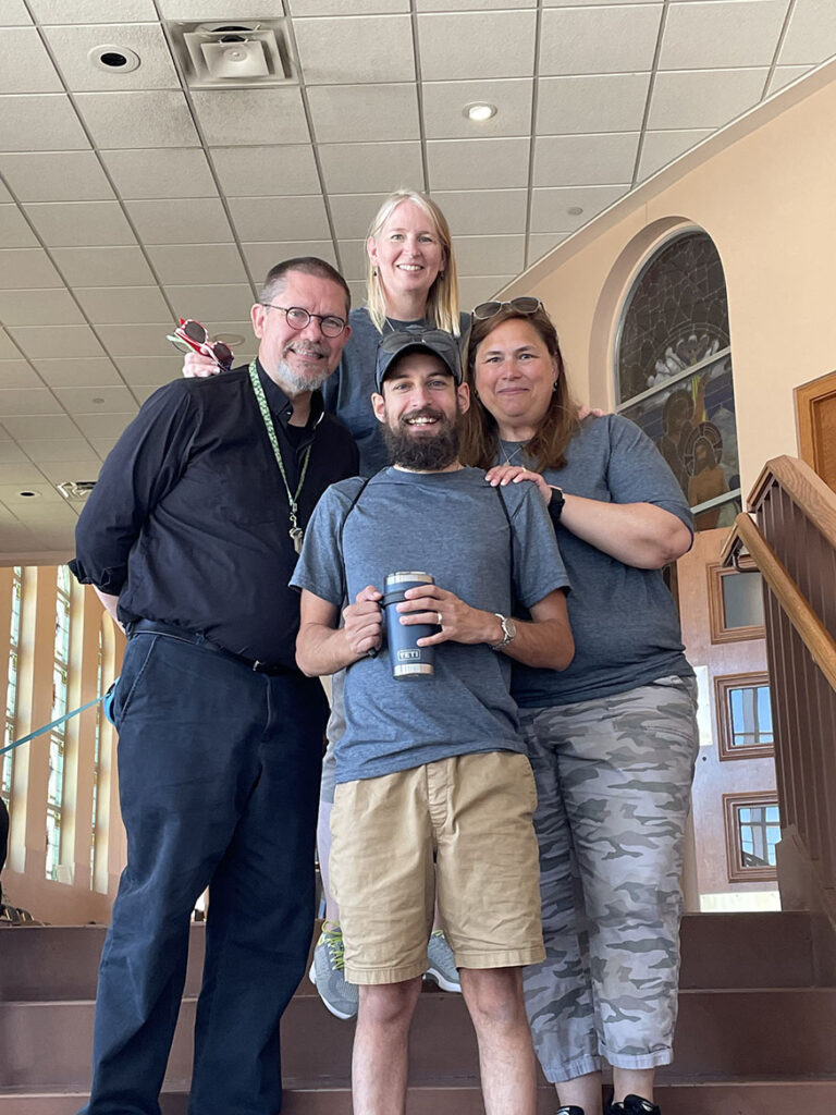 Bishop elect poses with his staff at St. Paul