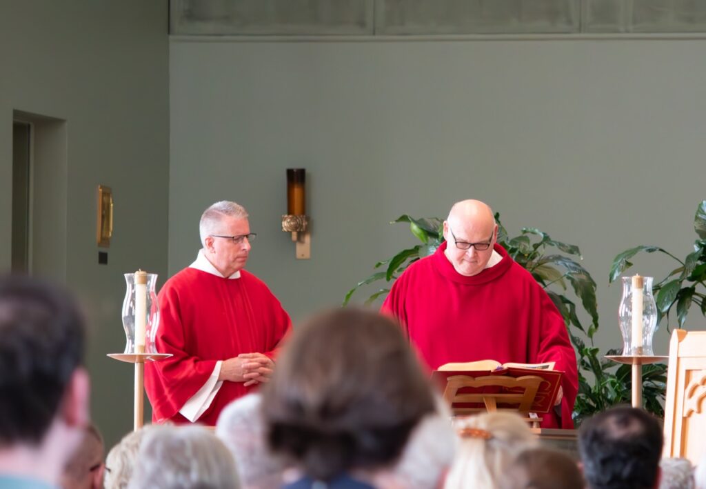 Father stands before the congregation at St. Brendan Parish on Holy Friday. Photo by Courtney Poullas.